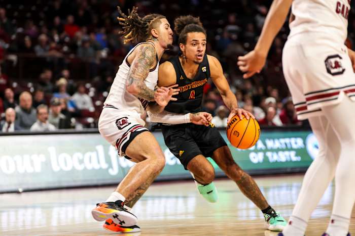 Myles Stute working to stay in front of a driving Winthrop forward (19th Dec., 2023)